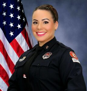 Portrait of Leisa Davis in her firefighter uniform