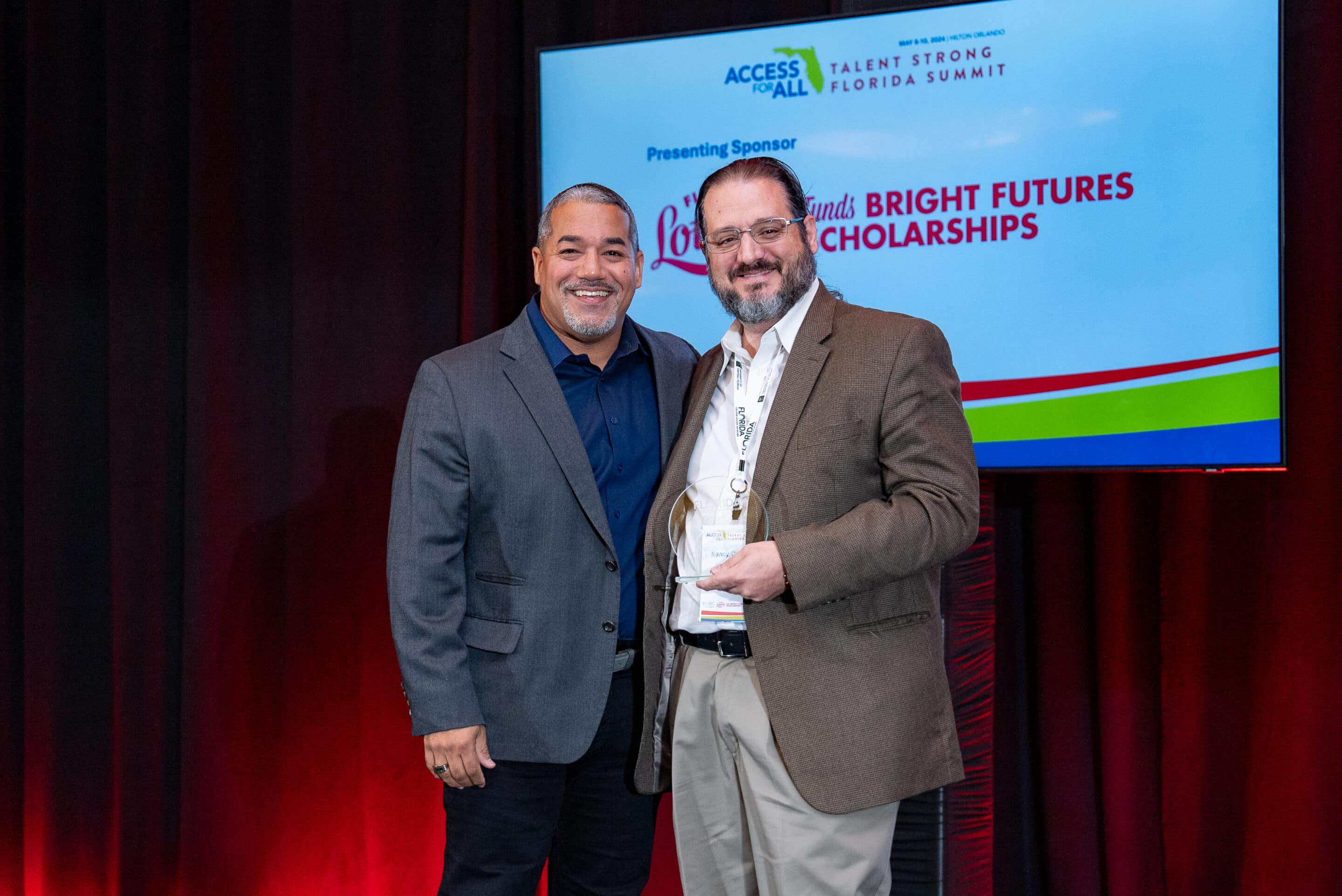 FCAN's executive director, Braulio Colón, and Miami Beach Senior High School's CAP Advisor, Kenny Cabrera at the 2024 Talent Strong Florida Summit.